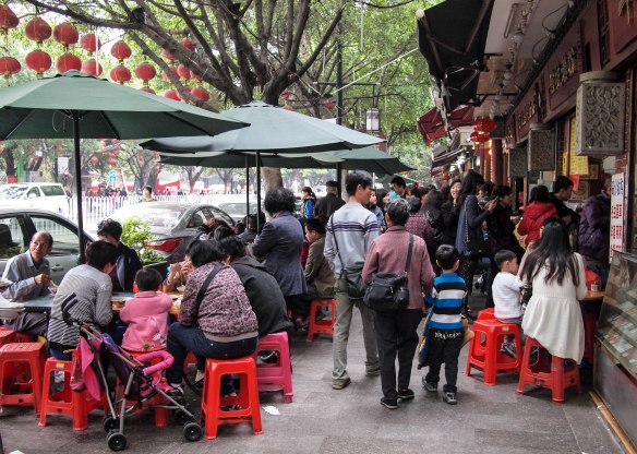 People eating and lining up to eat.