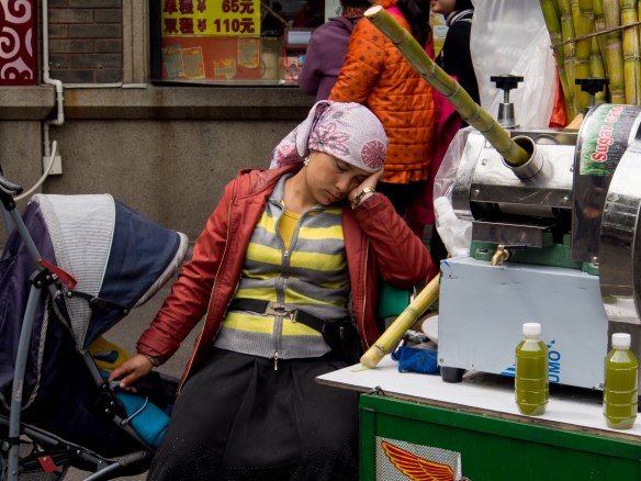 Sleeping sugar cane juice vendor.