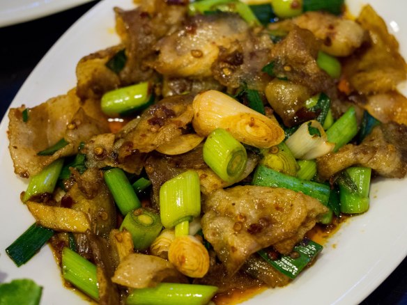 Cooked with lots of sliced scallion and a little minced chili pepper.